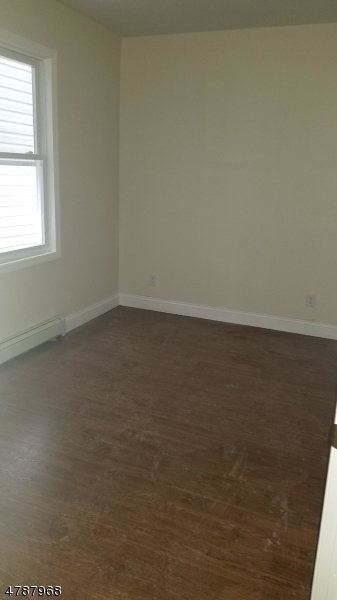 553 Walnut Street, Unit 1 Elizabeth, NJ 07201 - Photo 8 of 8 an empty room with a window