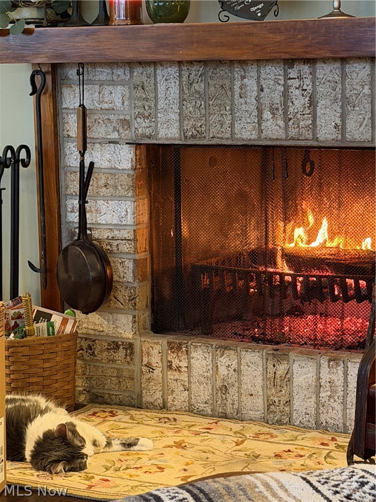 171 Granger Road, Unit 107 Medina, OH 44256 - Photo 12 of 41 Brick fireplace in the great room with a substantial wood mantel great for those cold winter nights.