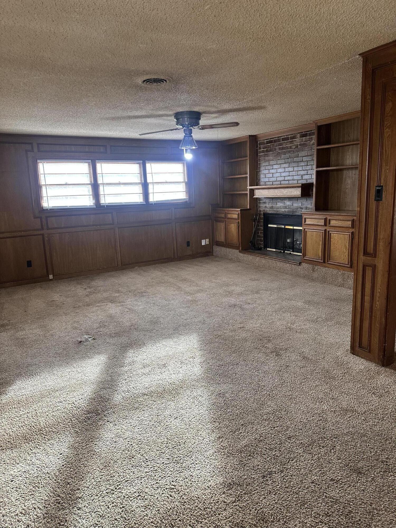 4918 14th Street Lubbock, TX 79416 - Photo 13 of 38 a view of a livingroom with a fireplace