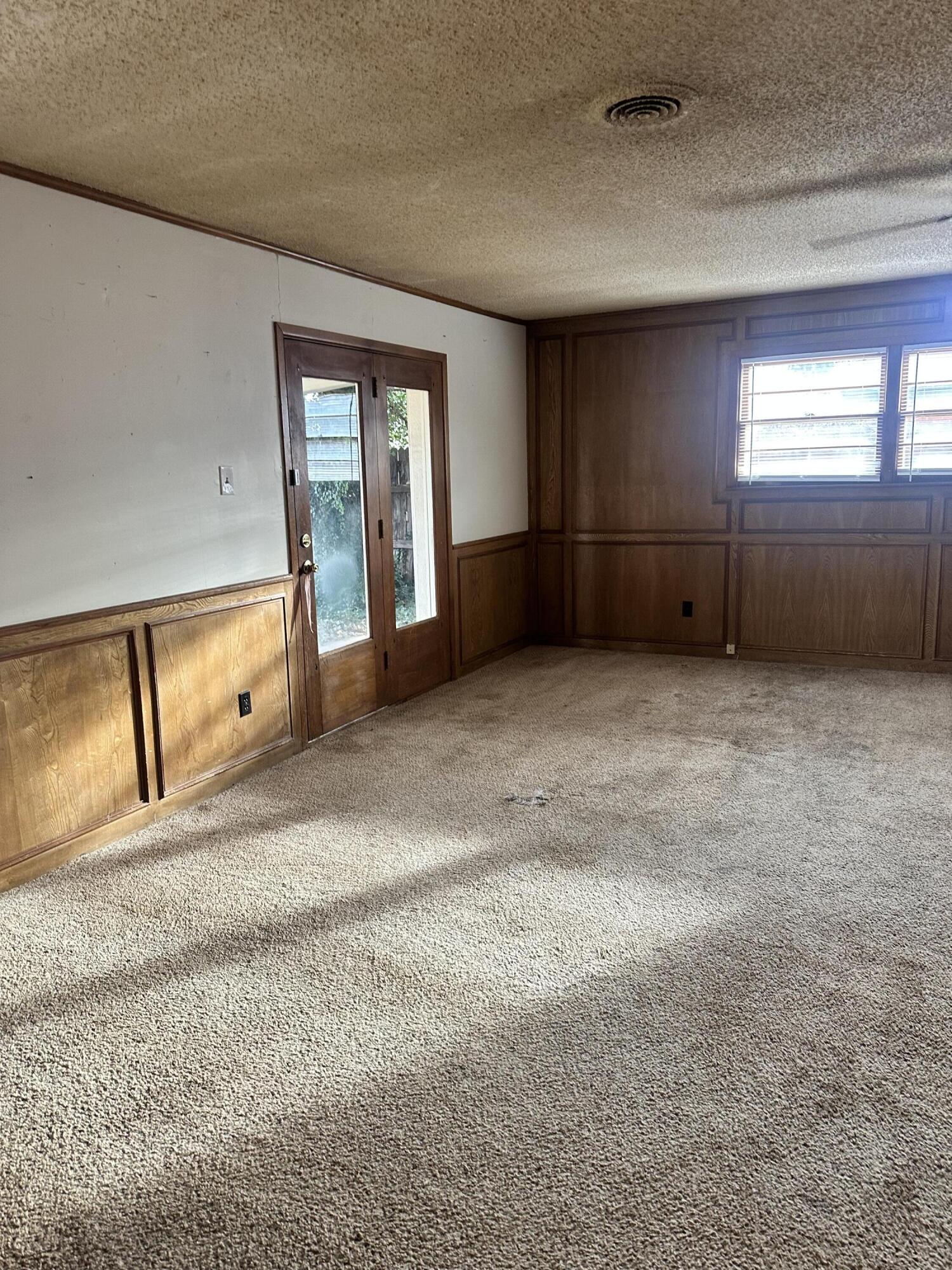 4918 14th Street Lubbock, TX 79416 - Photo 14 of 38 a view of an empty room with a window