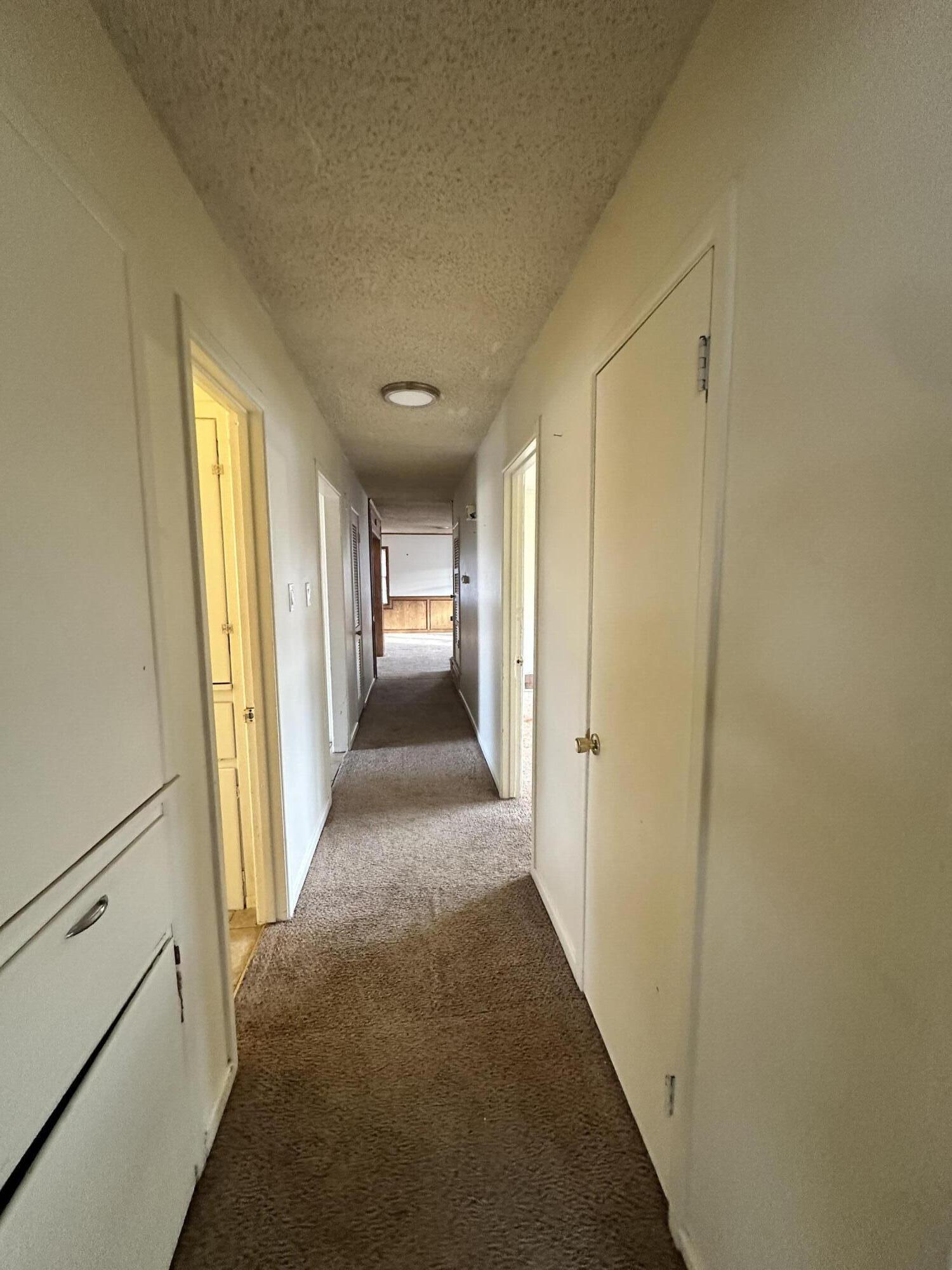 4918 14th Street Lubbock, TX 79416 - Photo 22 of 38 a view of a hallway with wooden floor and staircase