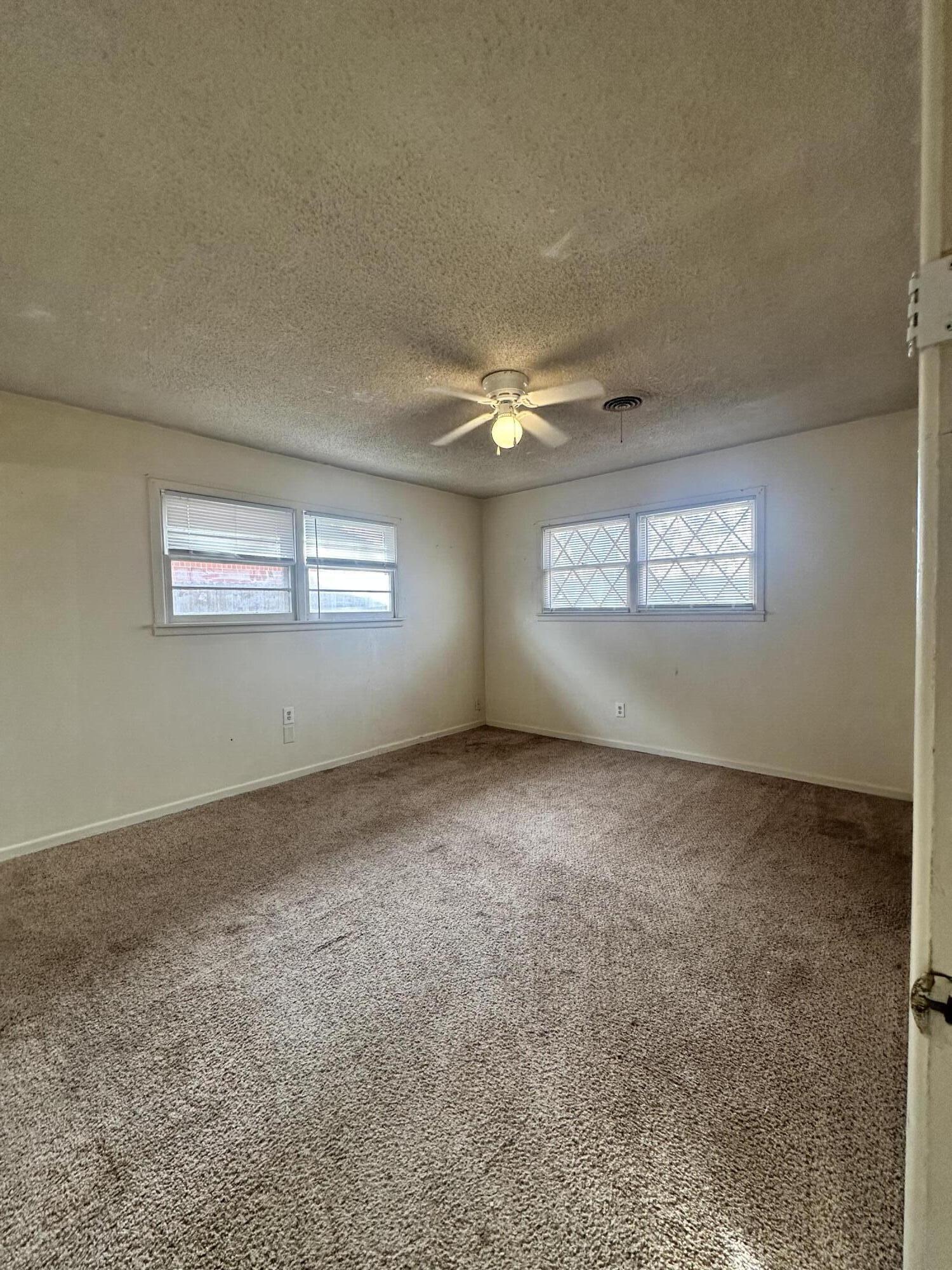 4918 14th Street Lubbock, TX 79416 - Photo 29 of 38 a view of an empty room with a window