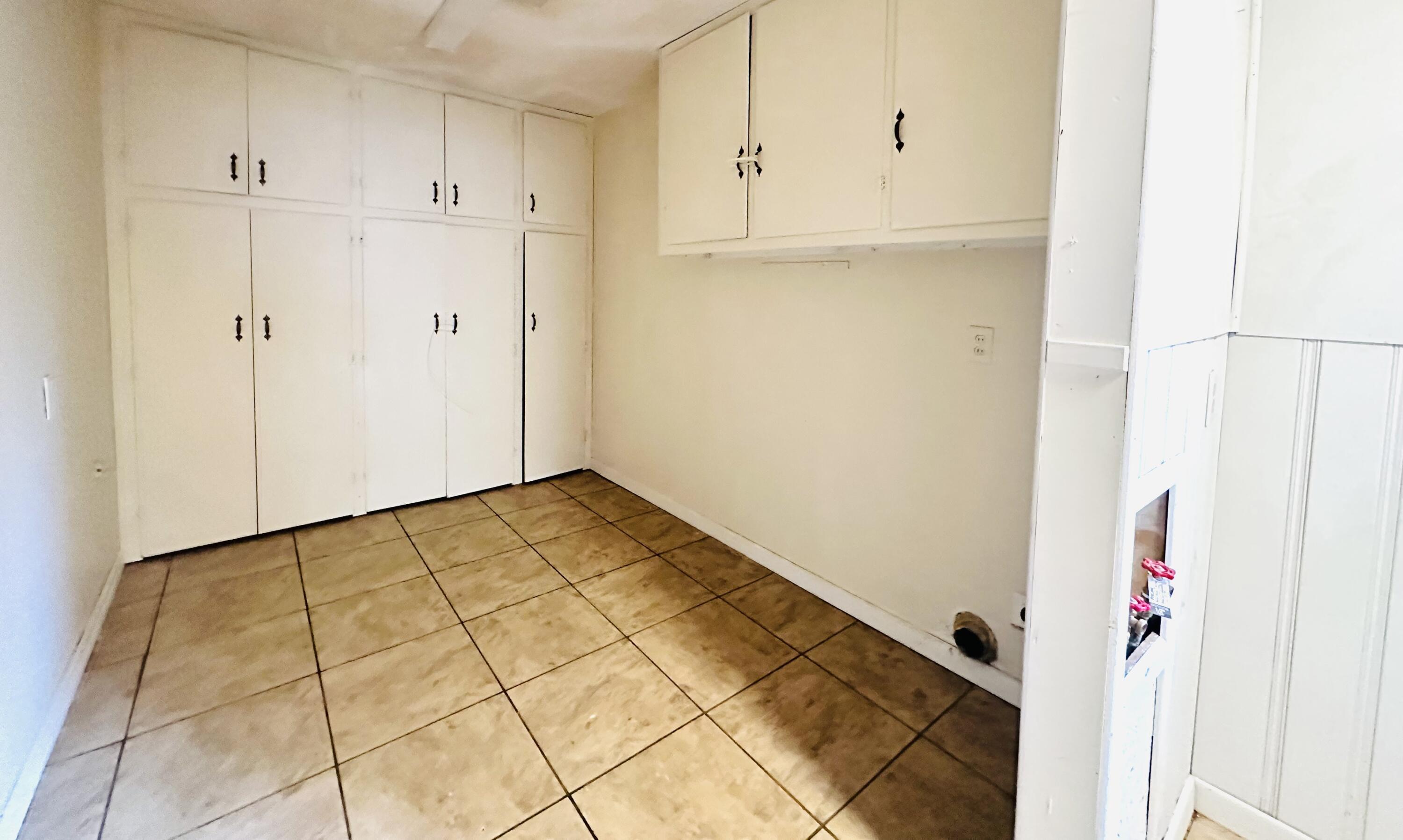4918 14th Street Lubbock, TX 79416 - Photo 34 of 38 a view of a kitchen with white cabinets