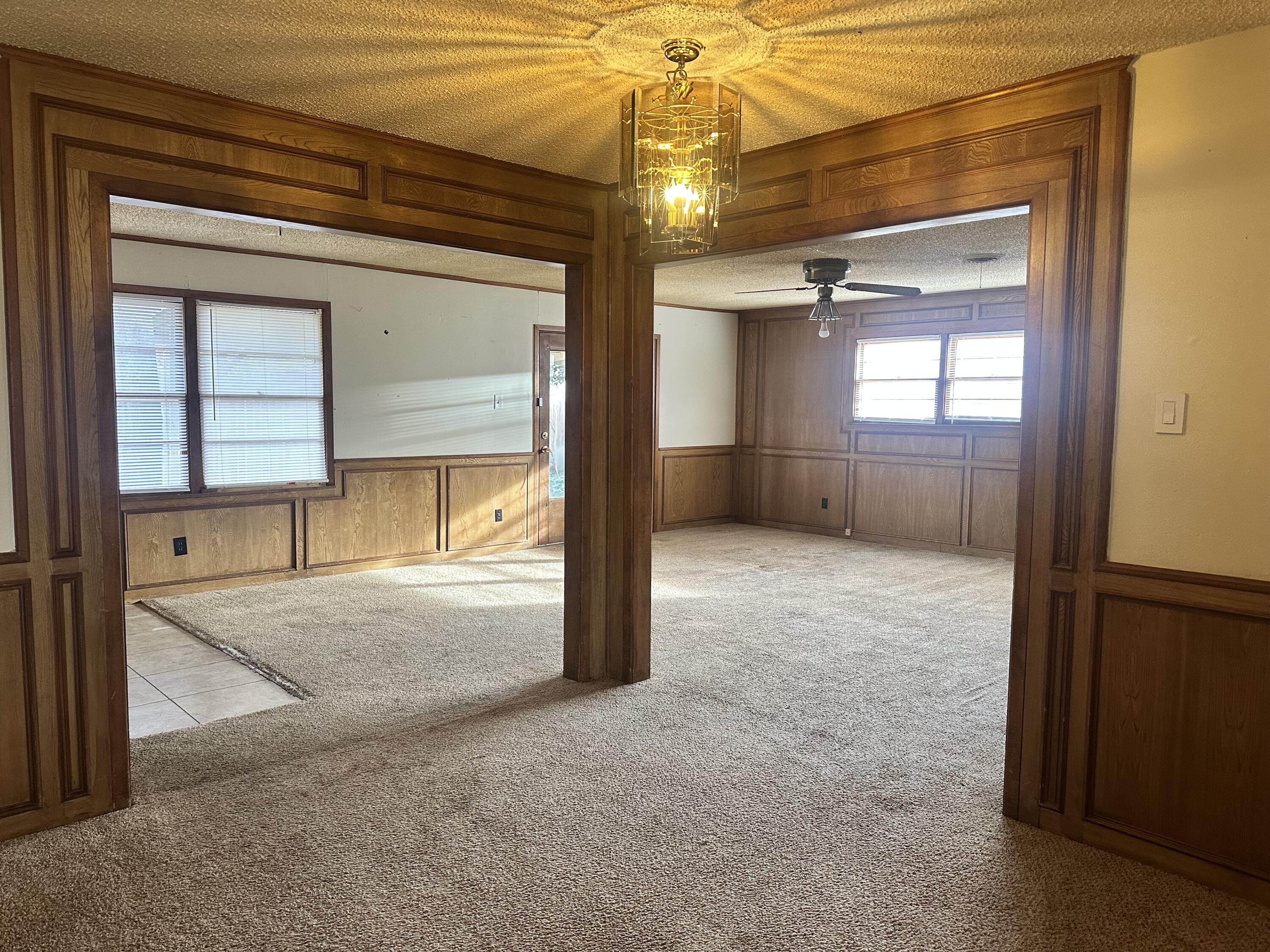 4918 14th Street Lubbock, TX 79416 - Photo 6 of 38 a view of a hallway with wooden shelves and door