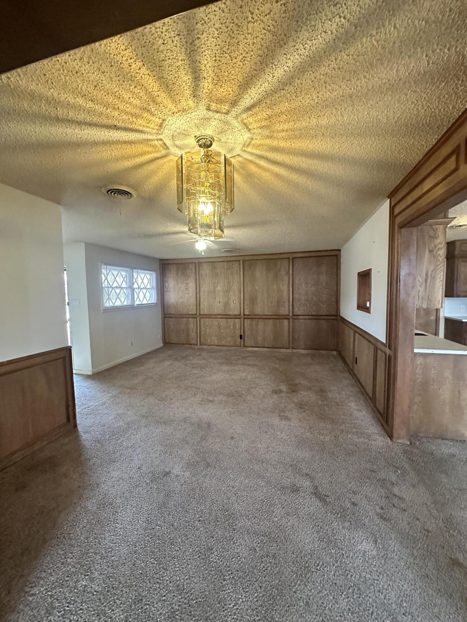 4918 14th Street Lubbock, TX 79416 - Photo 10 of 38 a view of empty room with a kitchen