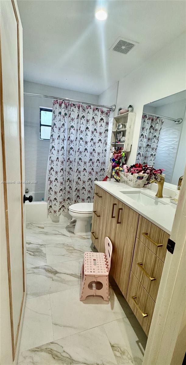 11178 Southwest 74th Terrace Miami, FL 33173 - Photo 13 of 18 a bathroom with a sink and a mirror