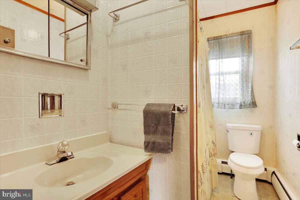 238 Grim Road Kutztown, PA 19530 - Photo 14 of 32 a bathroom with a sink toilet and shower