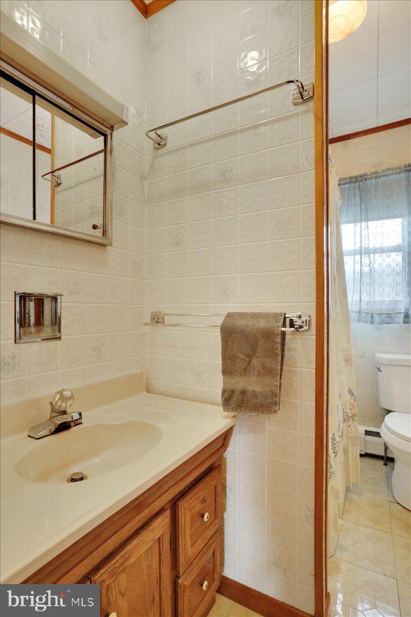 238 Grim Road Kutztown, PA 19530 - Photo 15 of 32 a bathroom with a sink and a toilet
