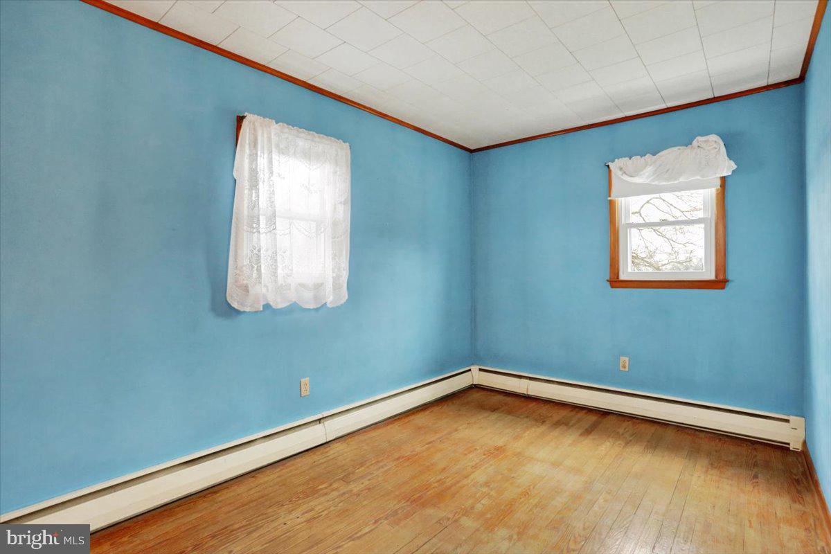 238 Grim Road Kutztown, PA 19530 - Photo 16 of 32 a view of a room with wooden floor and windows
