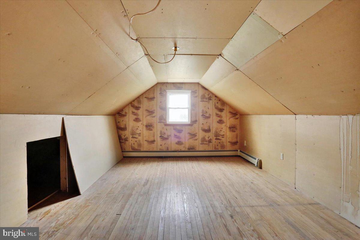 238 Grim Road Kutztown, PA 19530 - Photo 22 of 32 a view of a big room with wooden floor and windows