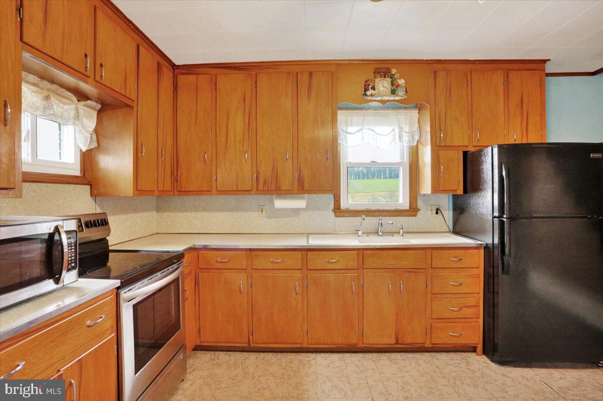 238 Grim Road Kutztown, PA 19530 - Photo 8 of 32 a kitchen with a refrigerator sink and stove