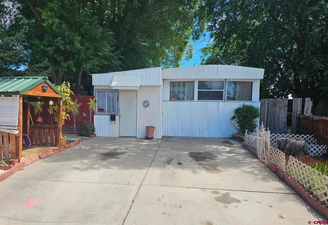 a front view of a house with a garage