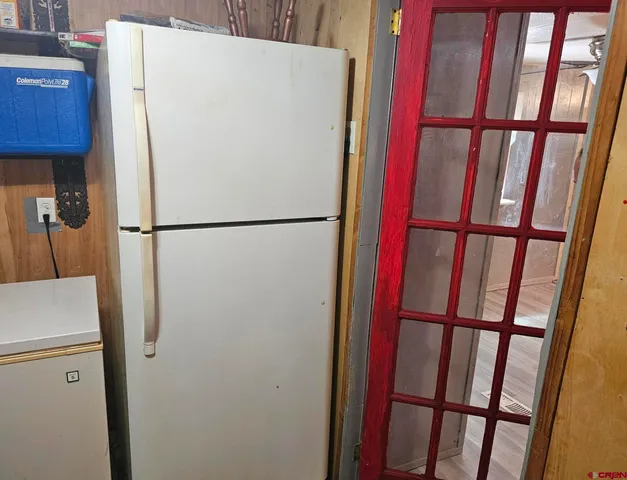 a white refrigerator freezer and a dishwasher