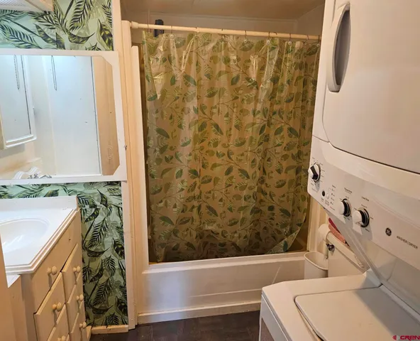 a bathroom with a bathtub and shower