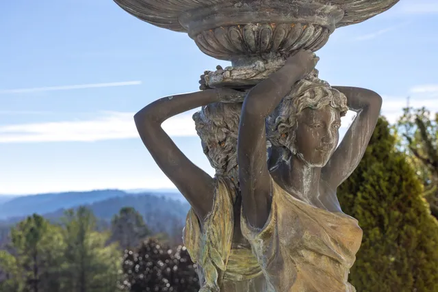 a large bedroom with a bed and large window