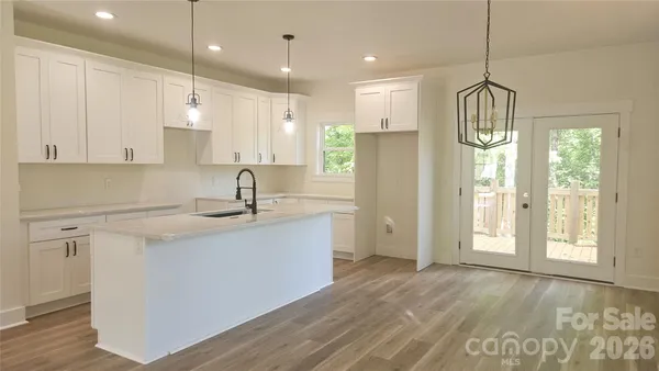 a bathroom with double vanity sinks a toilet and a mirror