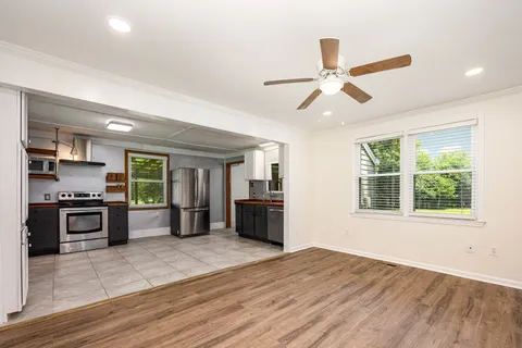 a kitchen with stainless steel appliances granite countertop a stove and a refrigerator