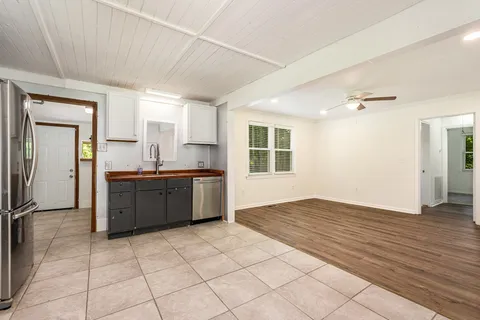 a view of a kitchen with a sink and a window