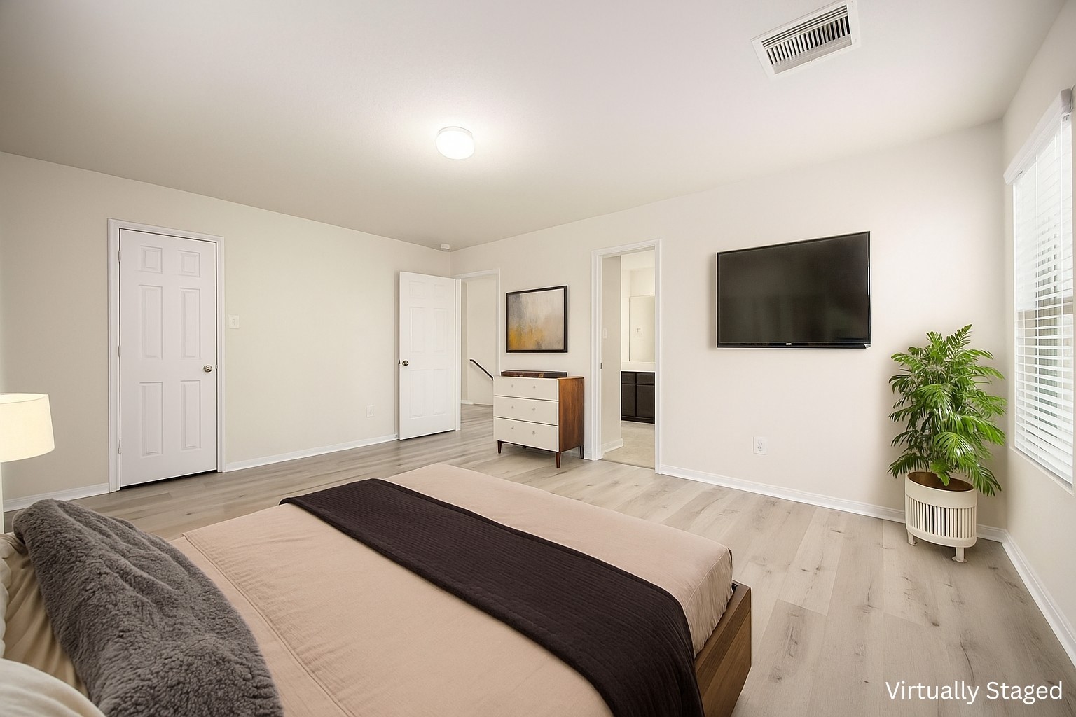 29322 Indian Clearing Spring, TX 77386 - Photo 11 of 41 a bedroom with a bed and a flat screen tv