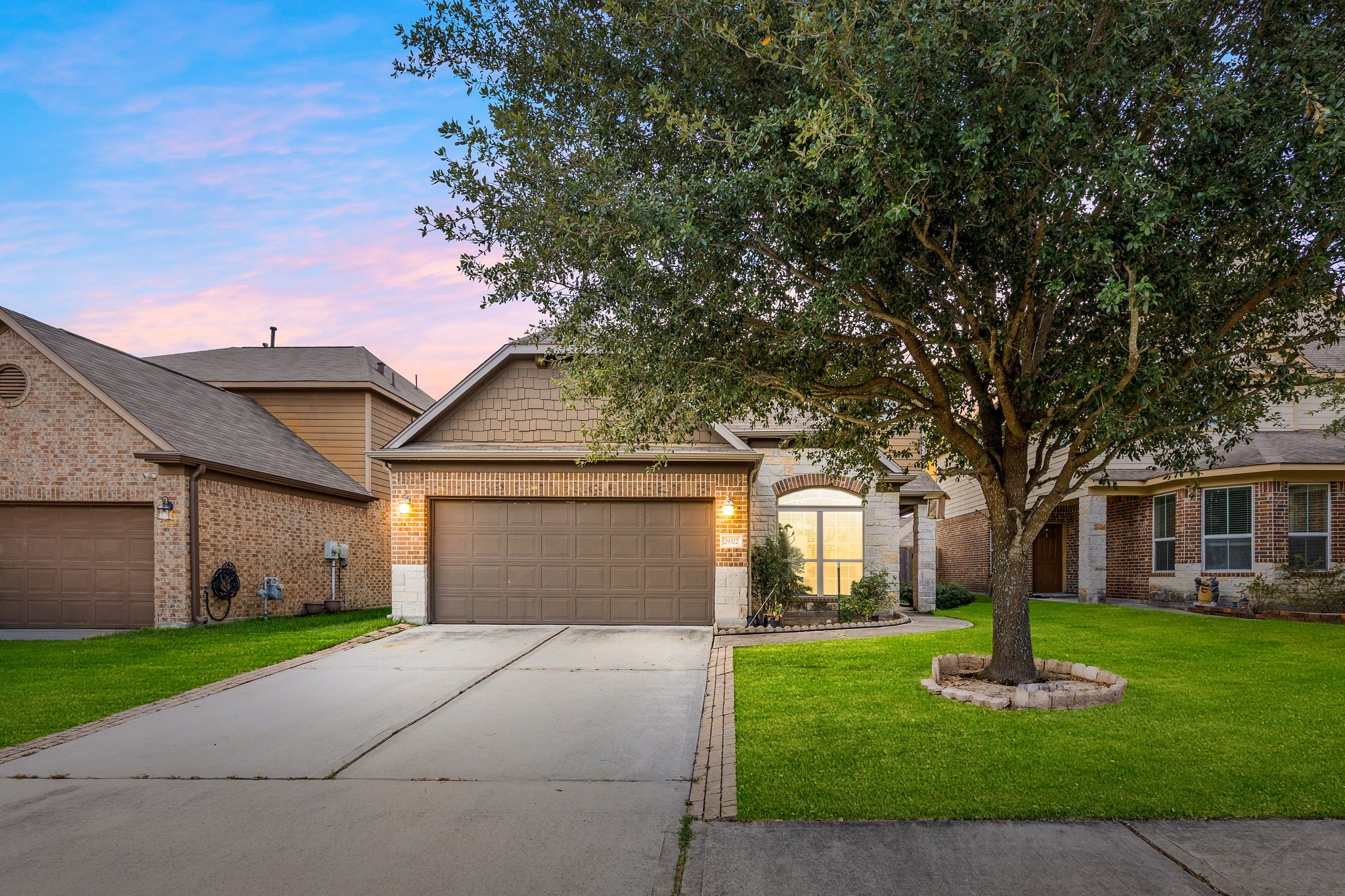 29322 Indian Clearing Spring, TX 77386 - Photo 2 of 41 a front view of a house with a garden