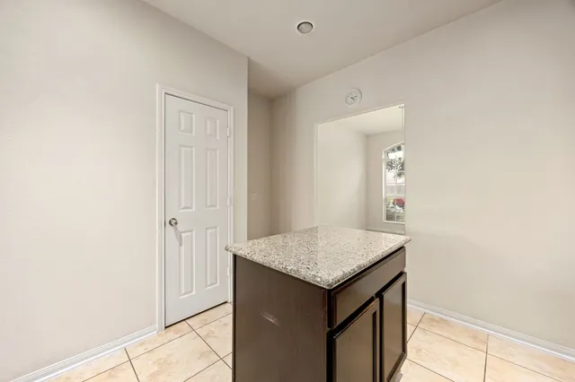 a bathroom with a granite countertop sink and vanity