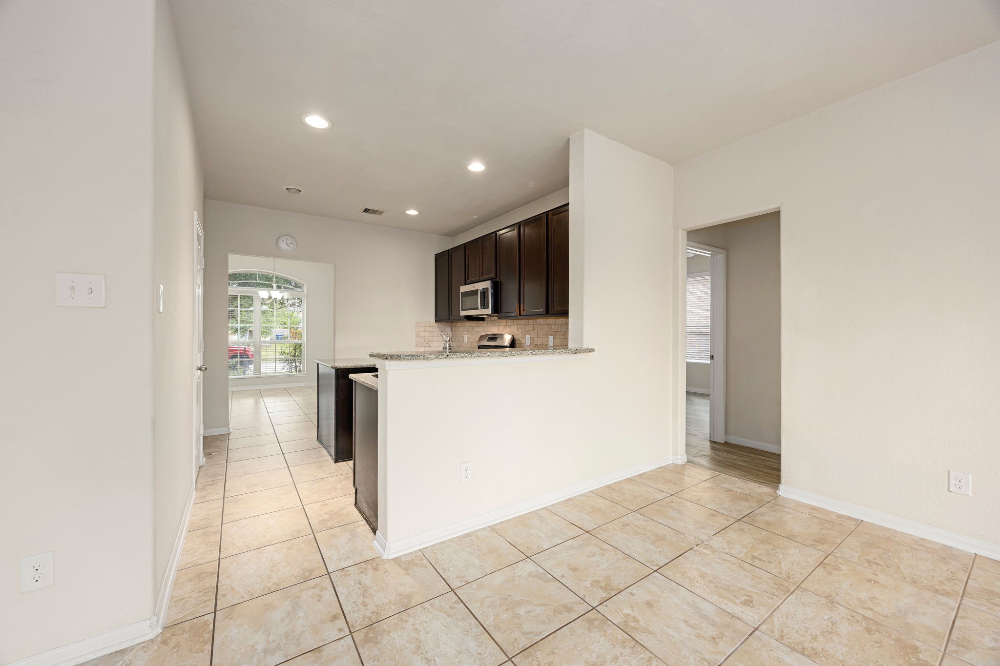 29322 Indian Clearing Spring, TX 77386 - Photo 22 of 41 a view of kitchen with furniture and wooden floor