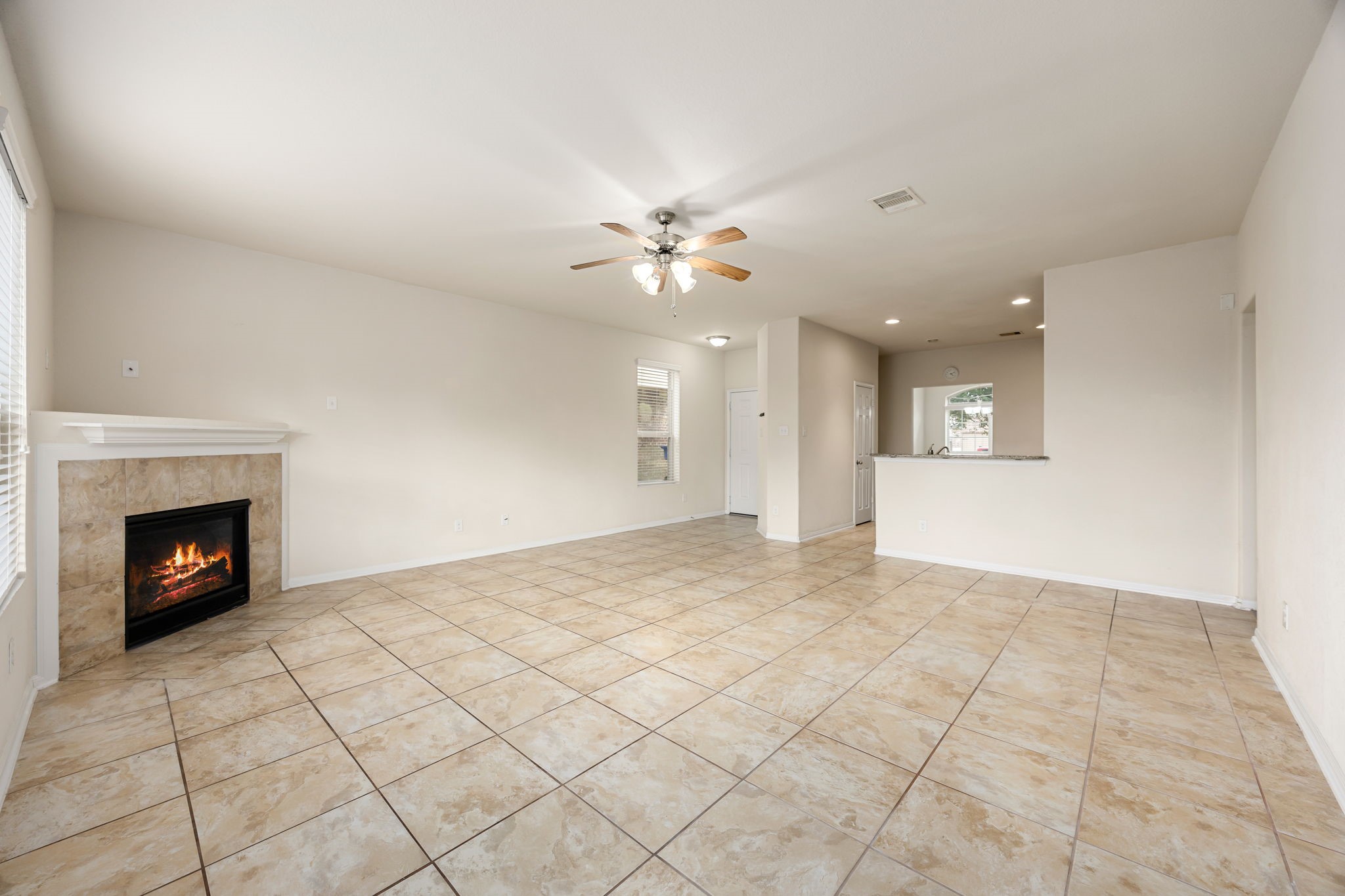 29322 Indian Clearing Spring, TX 77386 - Photo 23 of 41 a view of an empty room with a fireplace