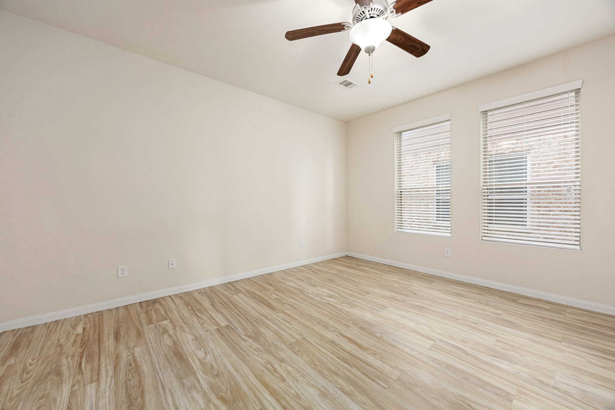 29322 Indian Clearing Spring, TX 77386 - Photo 24 of 41 wooden floor in an empty room with a window