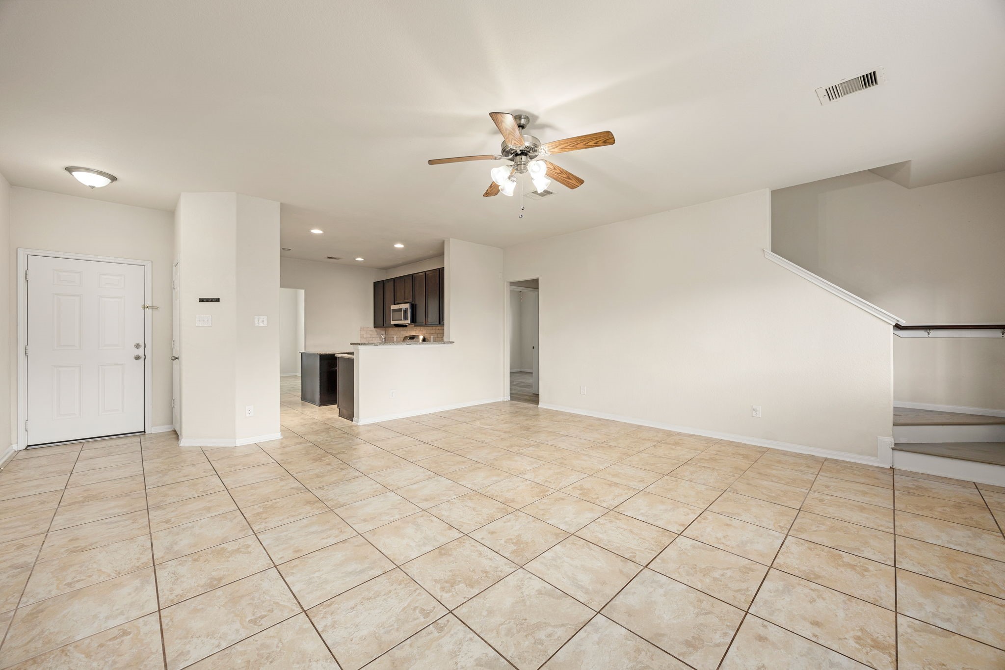 29322 Indian Clearing Spring, TX 77386 - Photo 25 of 41 a view of a kitchen with a sink and a refrigerator