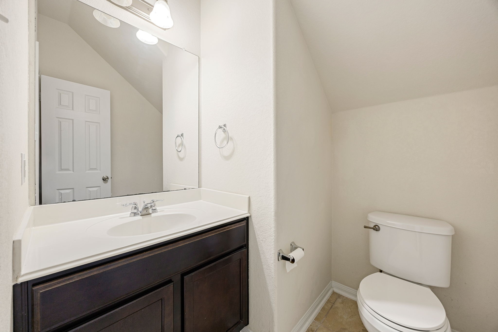 29322 Indian Clearing Spring, TX 77386 - Photo 26 of 41 a bathroom with a sink a toilet and a mirror