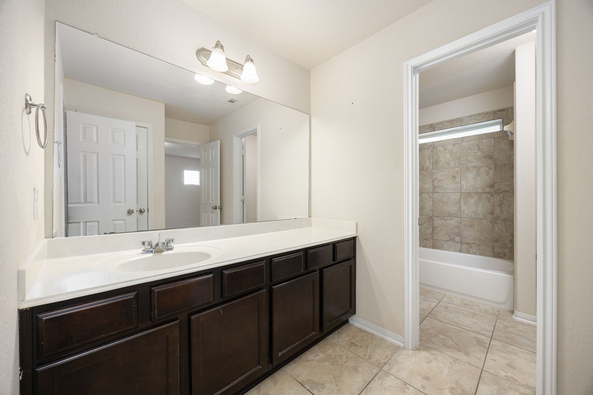 29322 Indian Clearing Spring, TX 77386 - Photo 28 of 41 a bathroom with a sink and a mirror