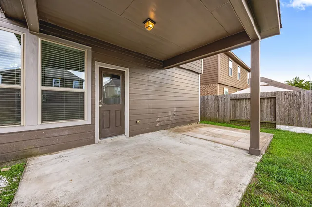 a view of a backyard of the house