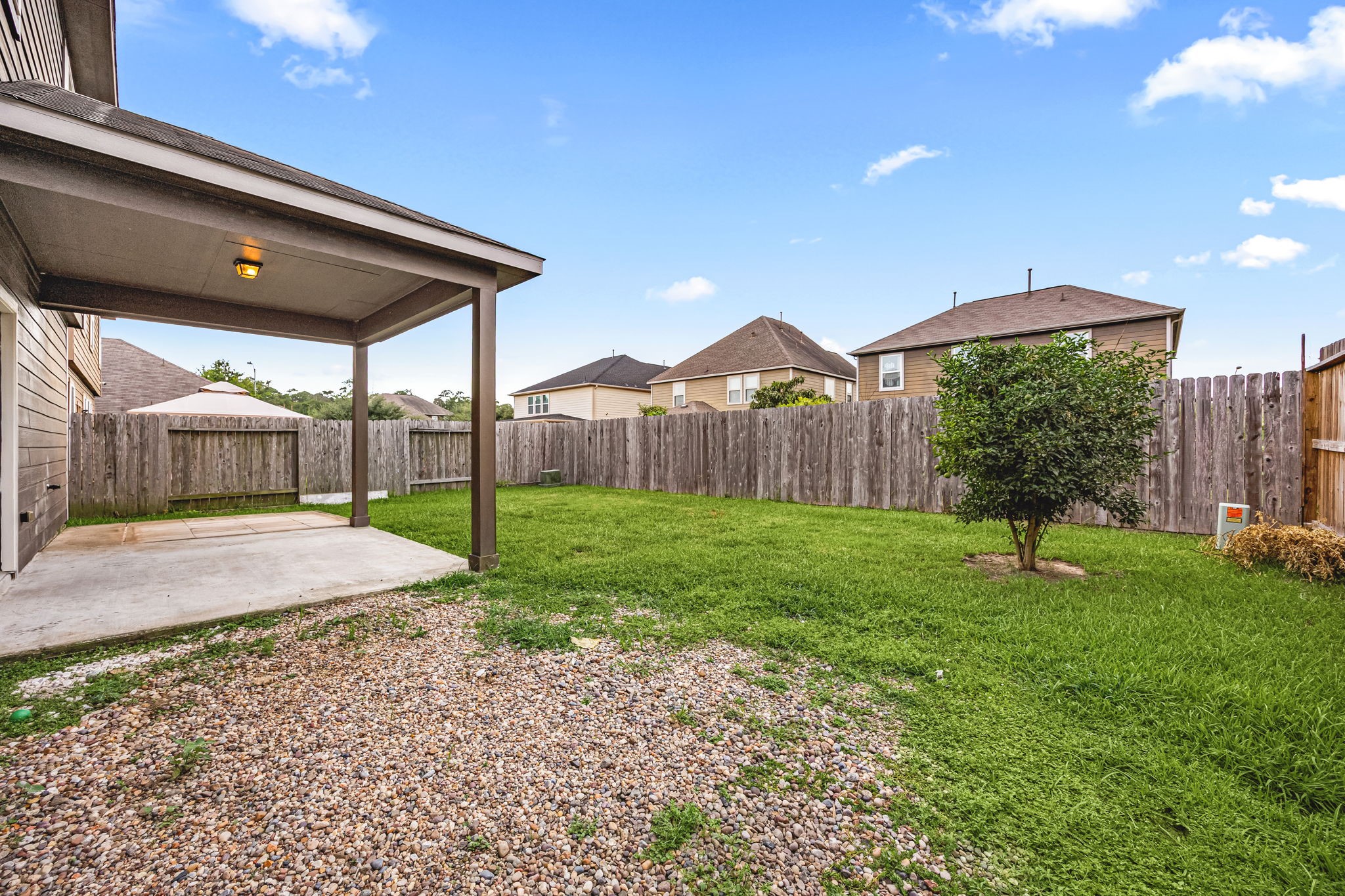29322 Indian Clearing Spring, TX 77386 - Photo 38 of 41 a backyard of a house with table and chairs