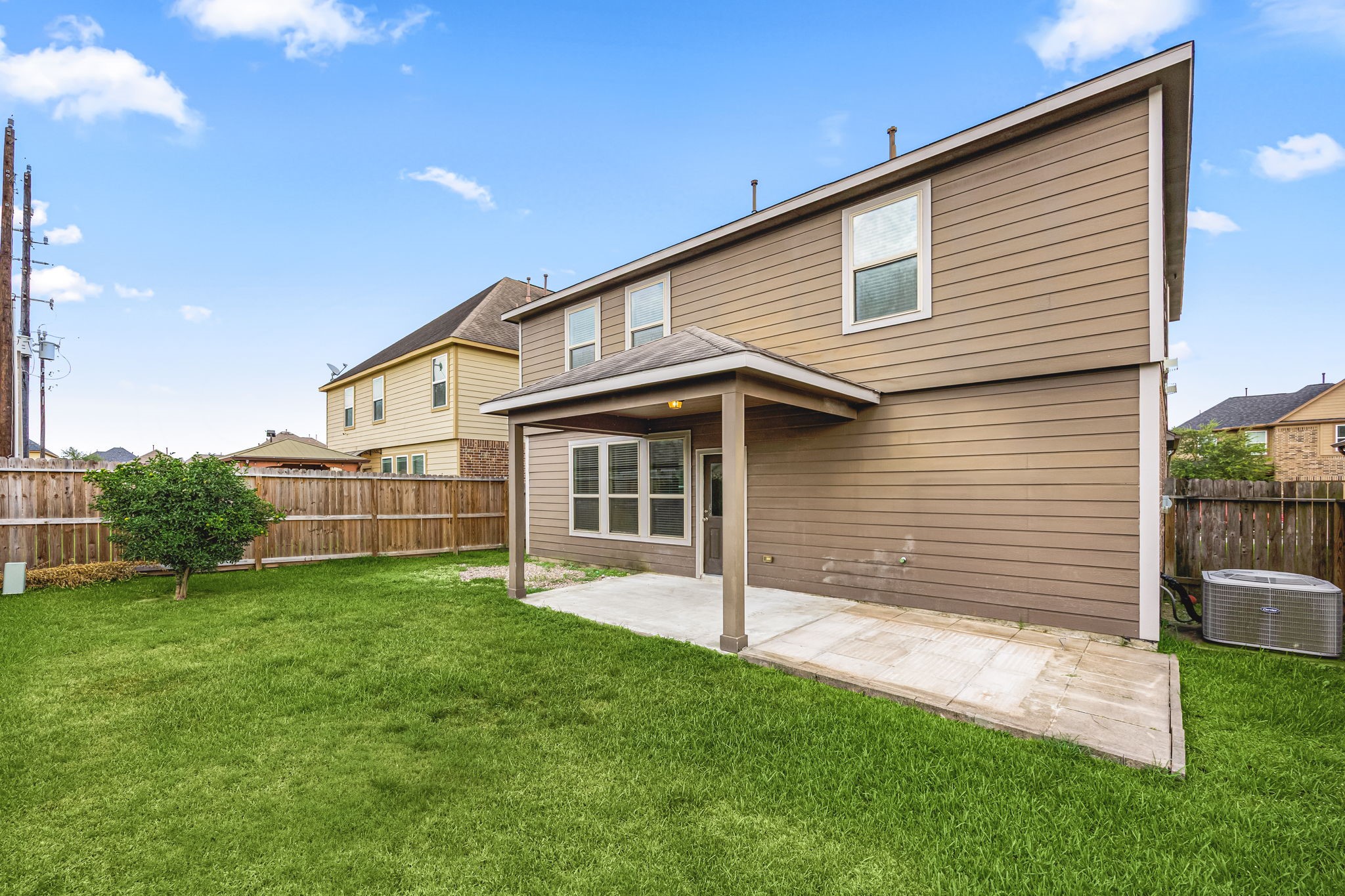 29322 Indian Clearing Spring, TX 77386 - Photo 39 of 41 a view of a house with a backyard