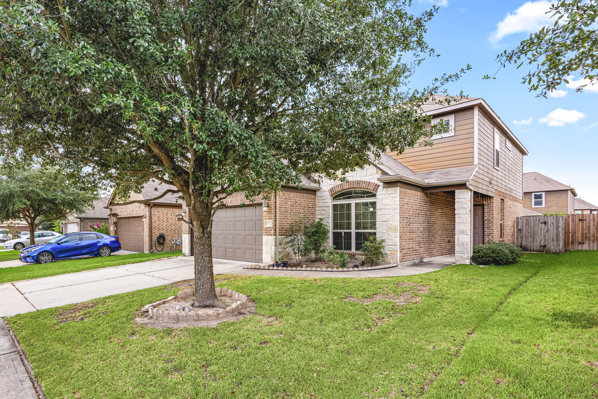 29322 Indian Clearing Spring, TX 77386 - Photo 5 of 41 a front view of house with yard and green space