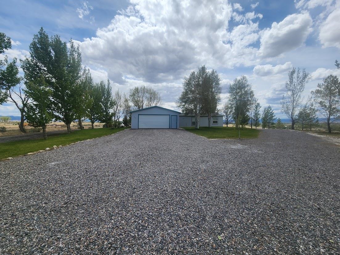 19548 B50 Road Delta, CO 81416 - Photo 23 of 37 a view of a field with trees in the background
