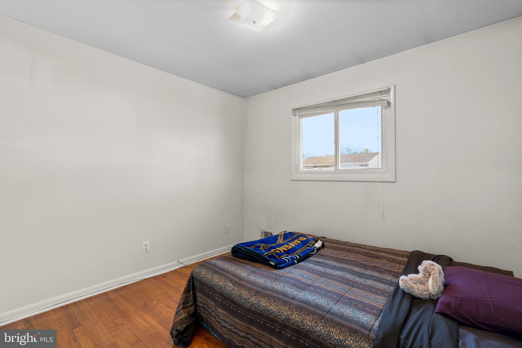 4727 Byron Road Windsor Mill, MD 21244 - Photo 18 of 35 a bedroom with a bed and a window