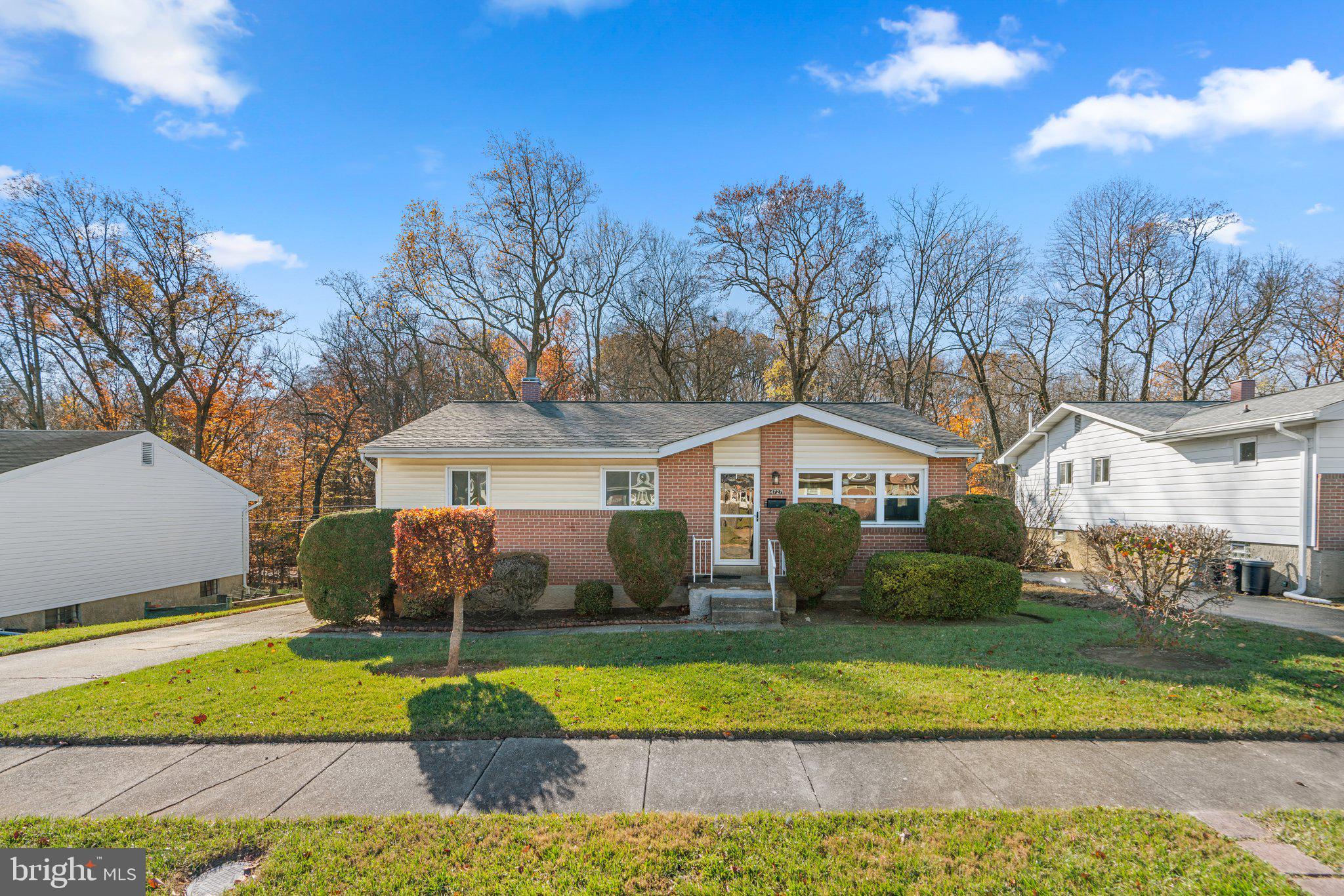 4727 Byron Road Windsor Mill, MD 21244 - Photo 2 of 35 a front view of a house with a yard and garage