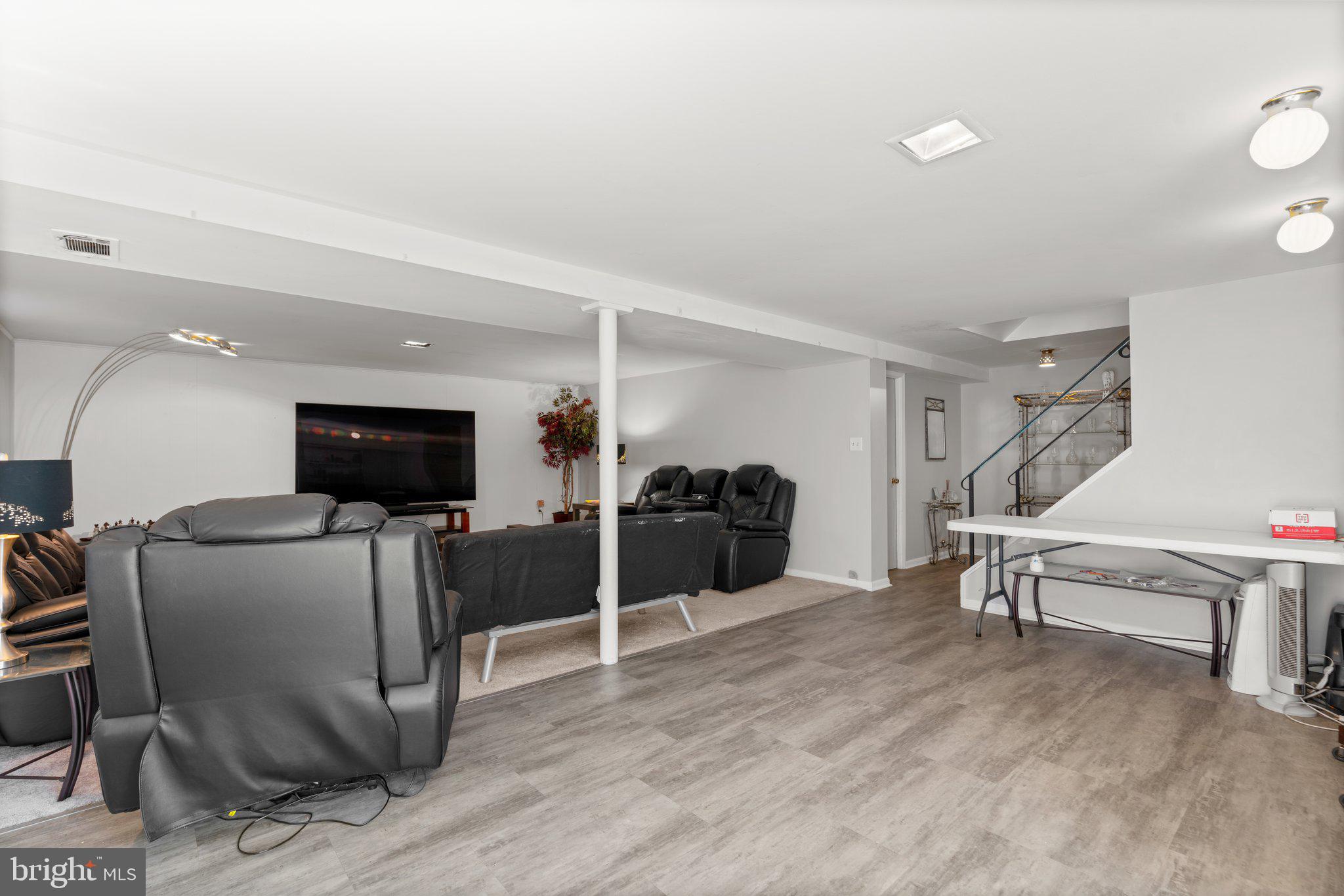 4727 Byron Road Windsor Mill, MD 21244 - Photo 23 of 35 a living room with furniture and a flat screen tv
