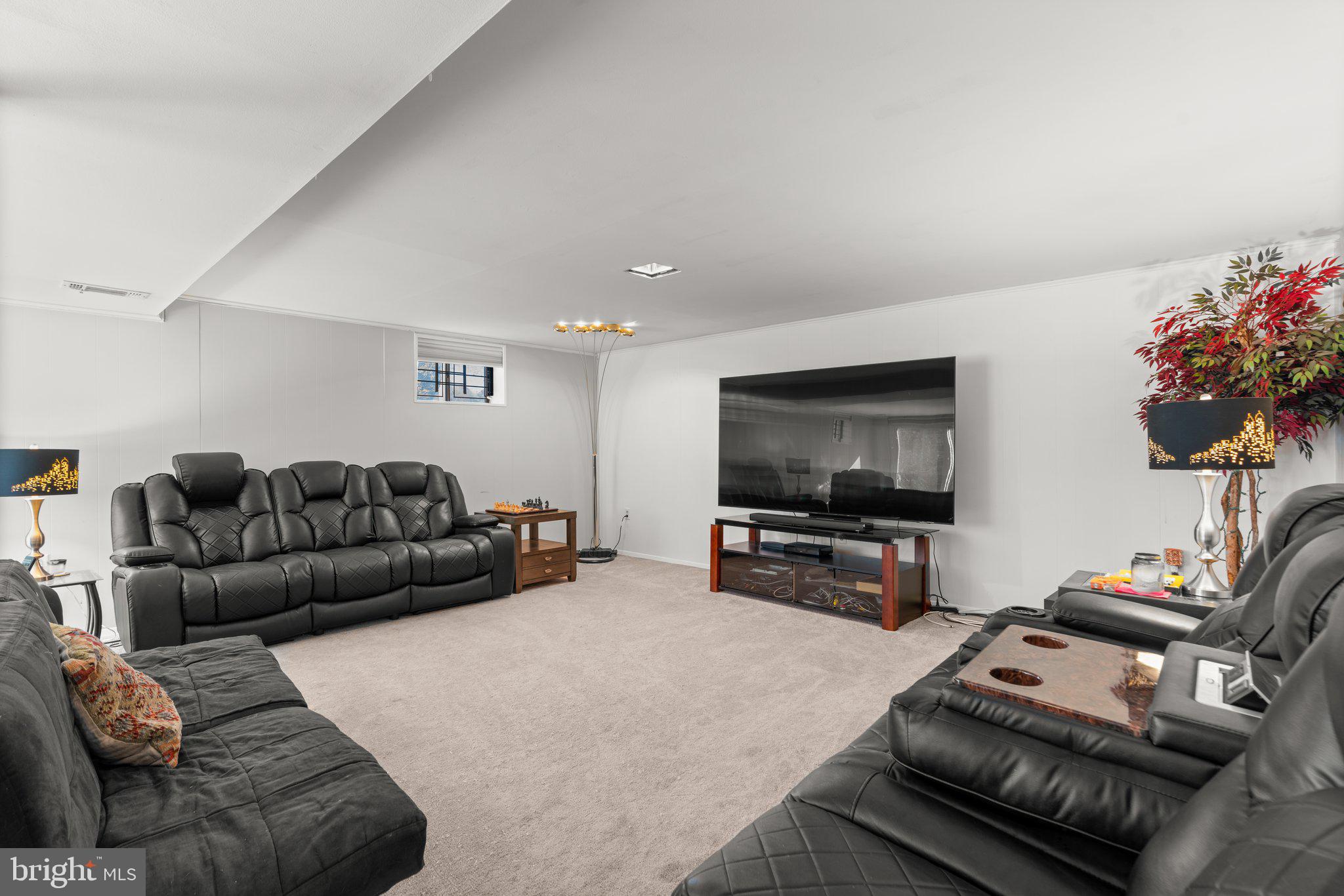 4727 Byron Road Windsor Mill, MD 21244 - Photo 24 of 35 a living room with furniture and a flat screen tv