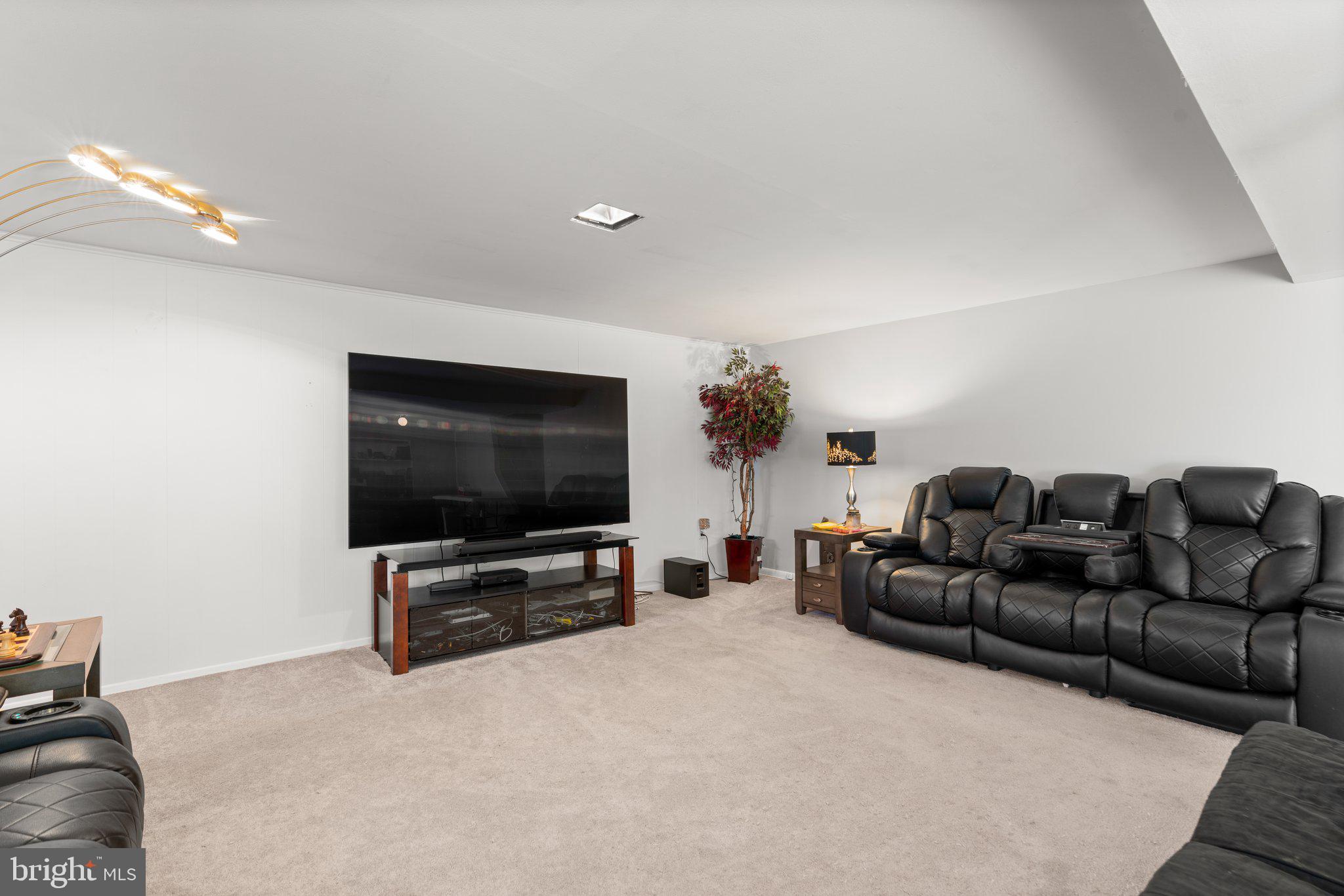 4727 Byron Road Windsor Mill, MD 21244 - Photo 25 of 35 a living room with furniture and a flat screen tv