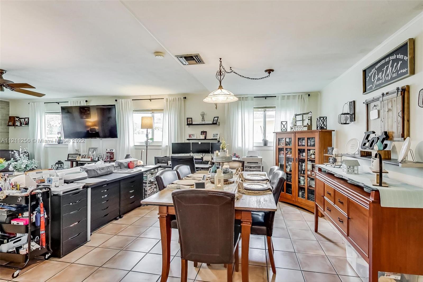 9345 Southwest 42nd Terrace Miami, FL 33165 - Photo 12 of 48 a view of a dining room kitchen and a sink