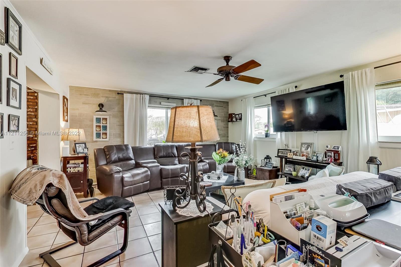 9345 Southwest 42nd Terrace Miami, FL 33165 - Photo 20 of 48 a living room with furniture and a flat screen tv