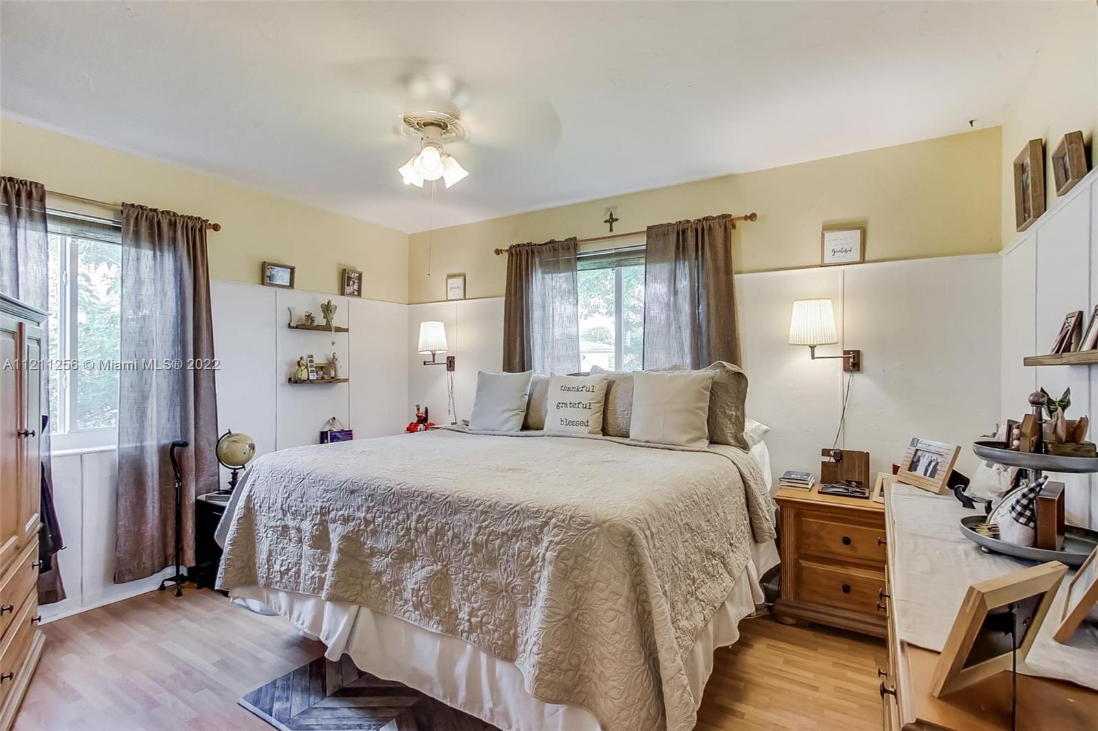 9345 Southwest 42nd Terrace Miami, FL 33165 - Photo 22 of 48 a bedroom with a bed and wooden floor