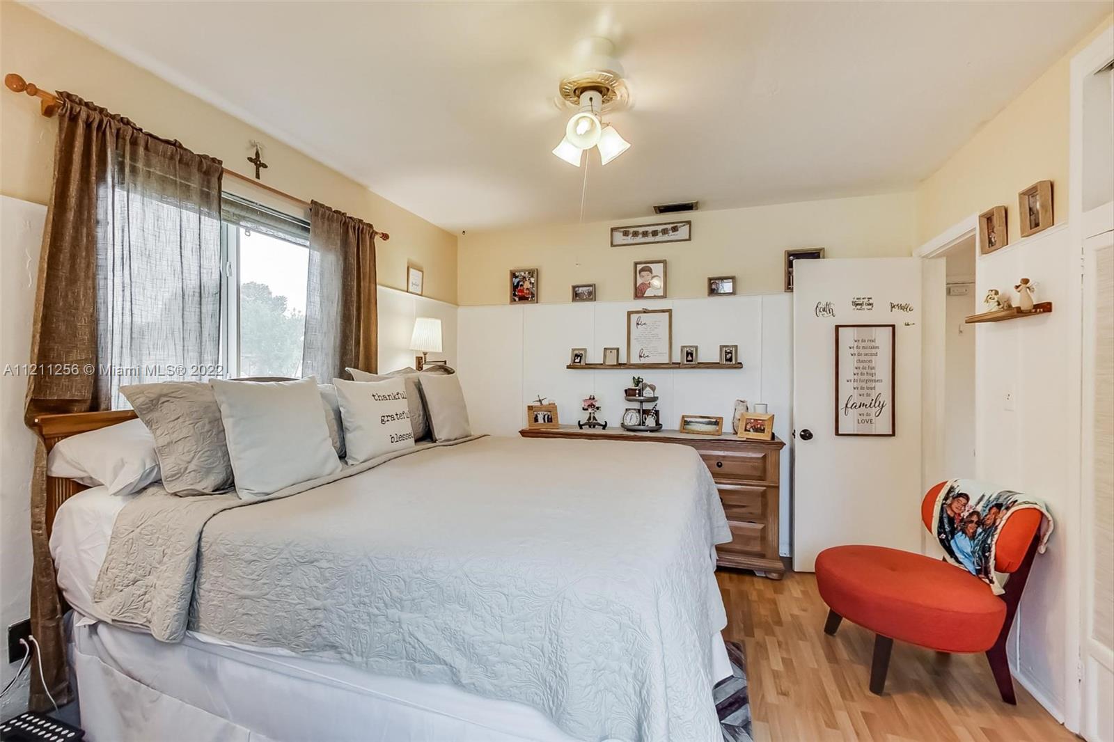 9345 Southwest 42nd Terrace Miami, FL 33165 - Photo 24 of 48 a bedroom with a bed and a couch