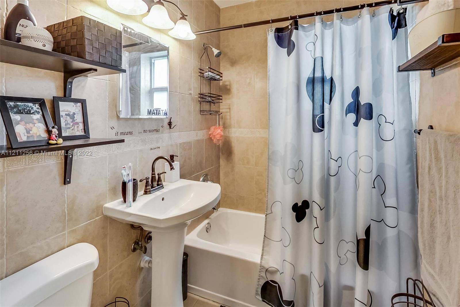 9345 Southwest 42nd Terrace Miami, FL 33165 - Photo 31 of 48 a bathroom with a sink toilet and shower