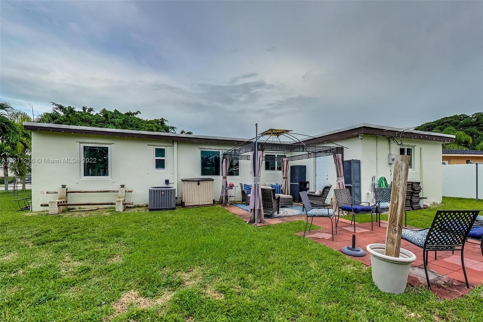 9345 Southwest 42nd Terrace Miami, FL 33165 - Photo 38 of 48 a patio with table and chairs