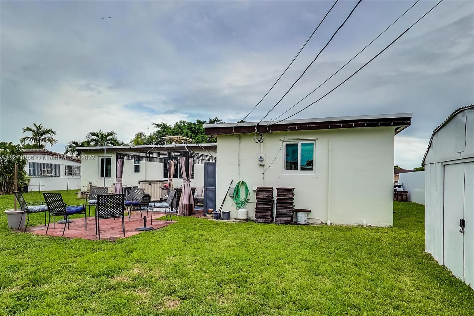 9345 Southwest 42nd Terrace Miami, FL 33165 - Photo 39 of 48 a view of a house with backyard and porch