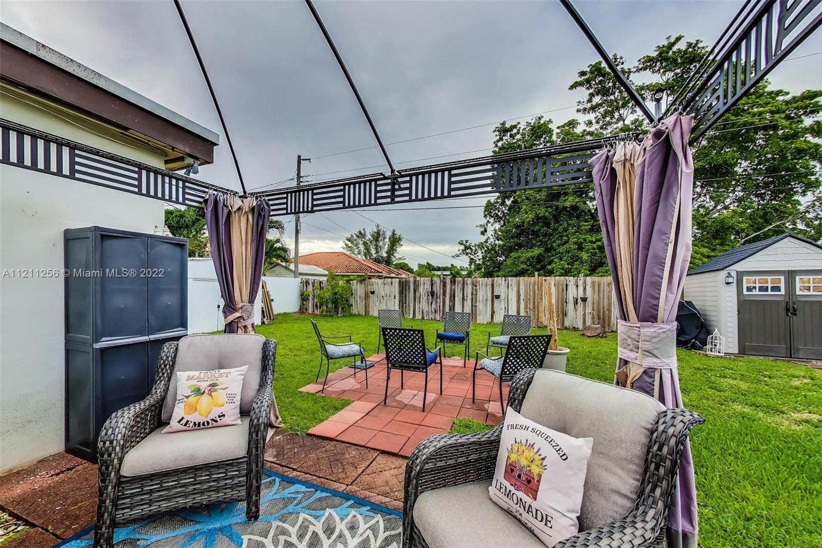 9345 Southwest 42nd Terrace Miami, FL 33165 - Photo 42 of 48 a outdoor living space with furniture and a garden