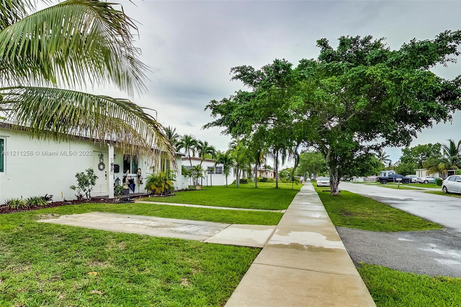 9345 Southwest 42nd Terrace Miami, FL 33165 - Photo 7 of 48 a front view of a house with garden